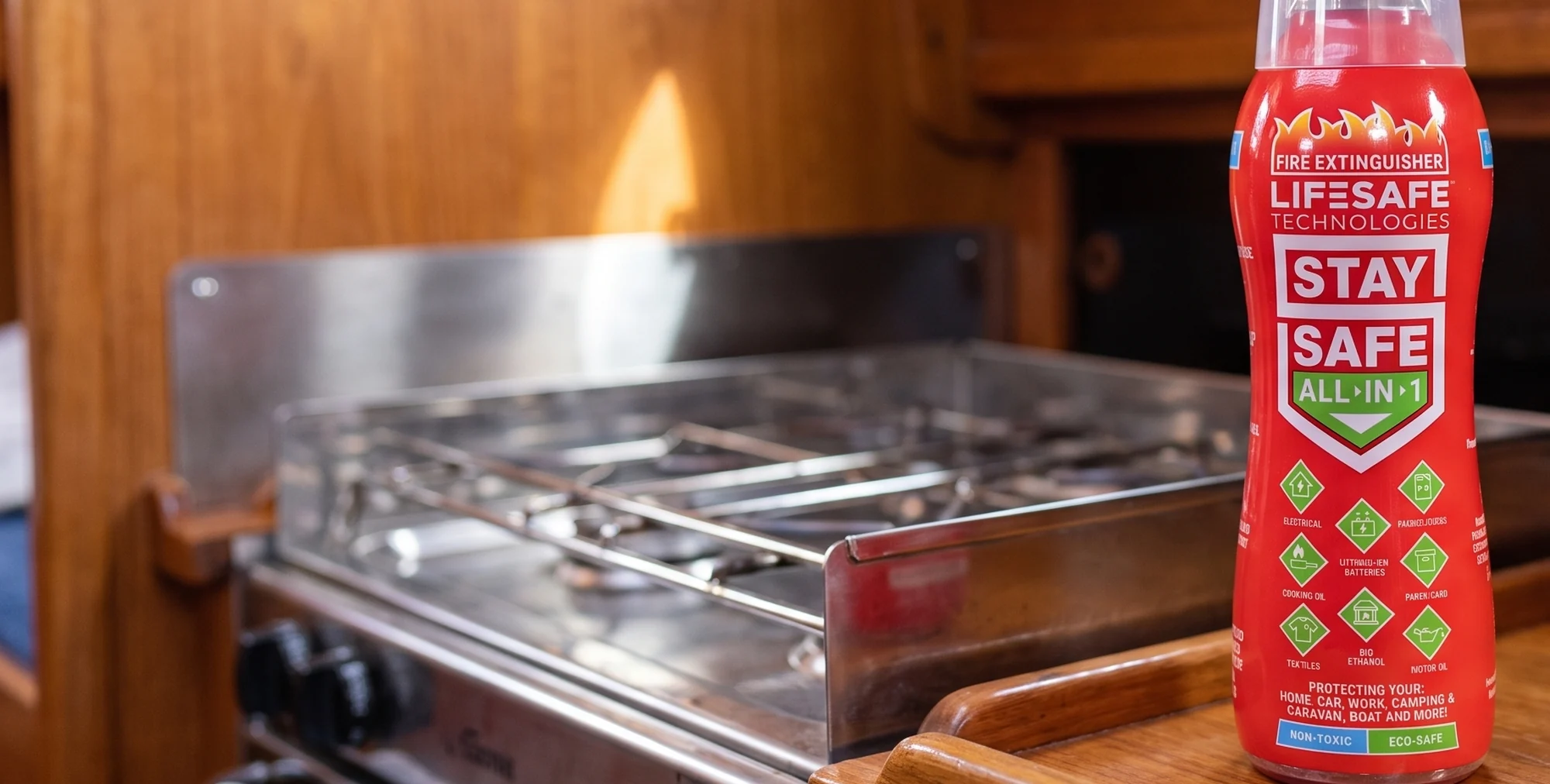 A StaySafe All-in-1 on the galley worktop of a boat, beside the stove